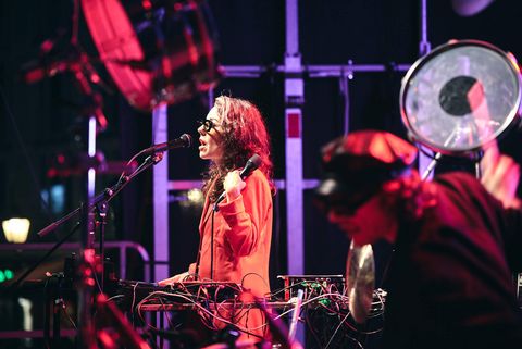 A singer entertains her audience on stage.