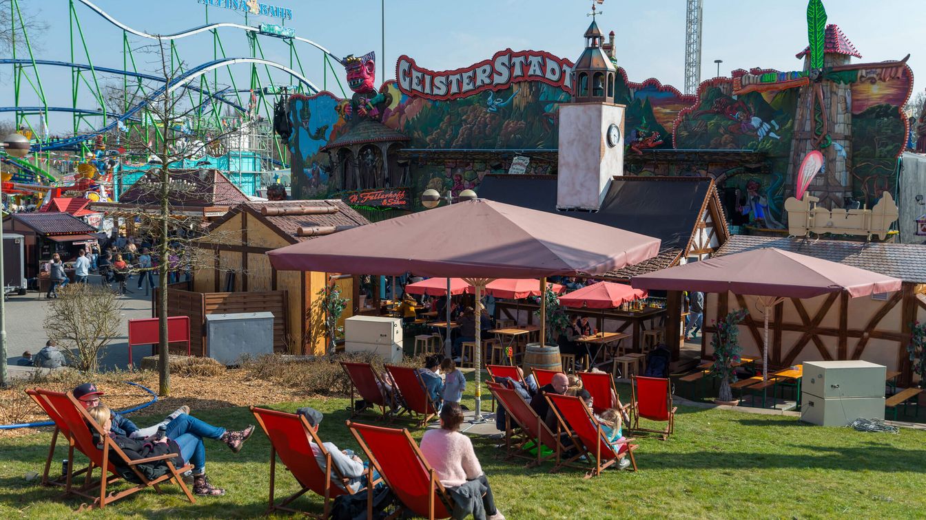 Guests relax in deckchairs from the hustle and bustle of the festival. 