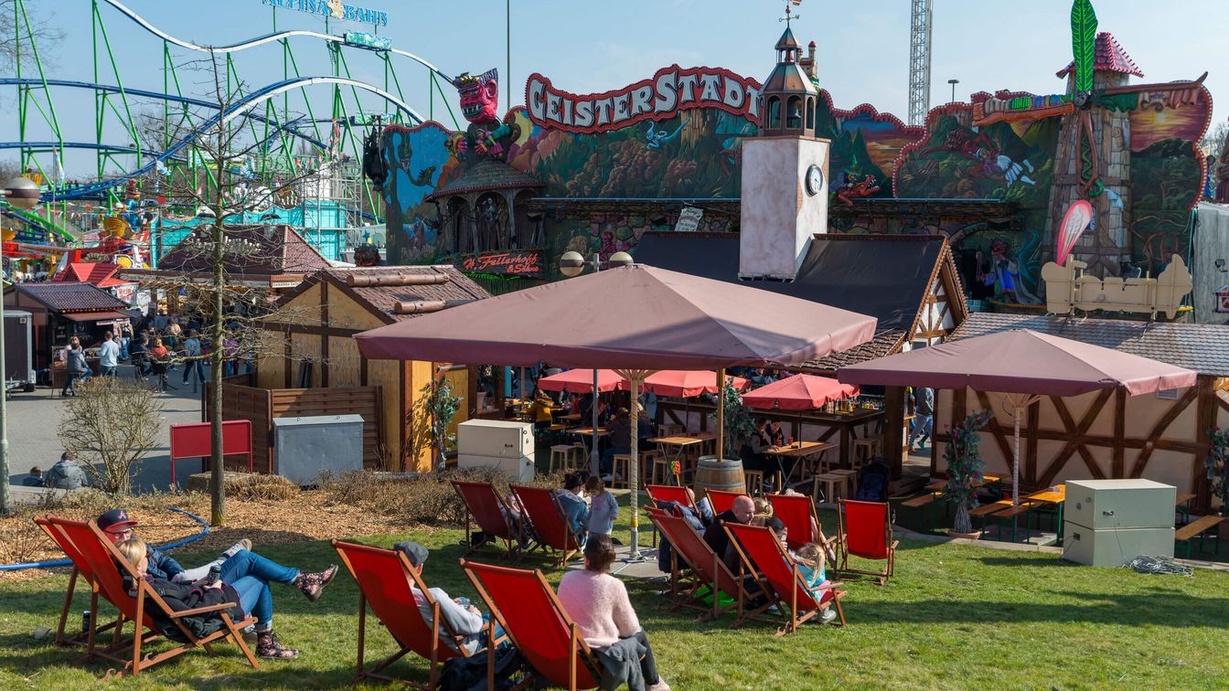 Guests relax in deckchairs from the hustle and bustle of the festival. 