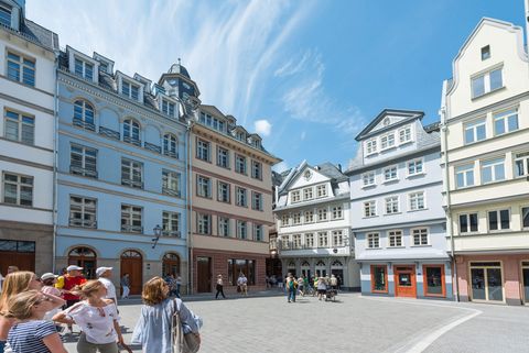 A group looks at reconstructed buildings of the New Alstadt