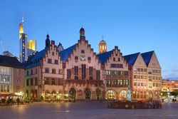 A deserted Römerberg with an illuminated town hall