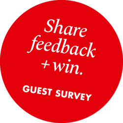 Red circle with text “Share feedback + win. Guest survey”